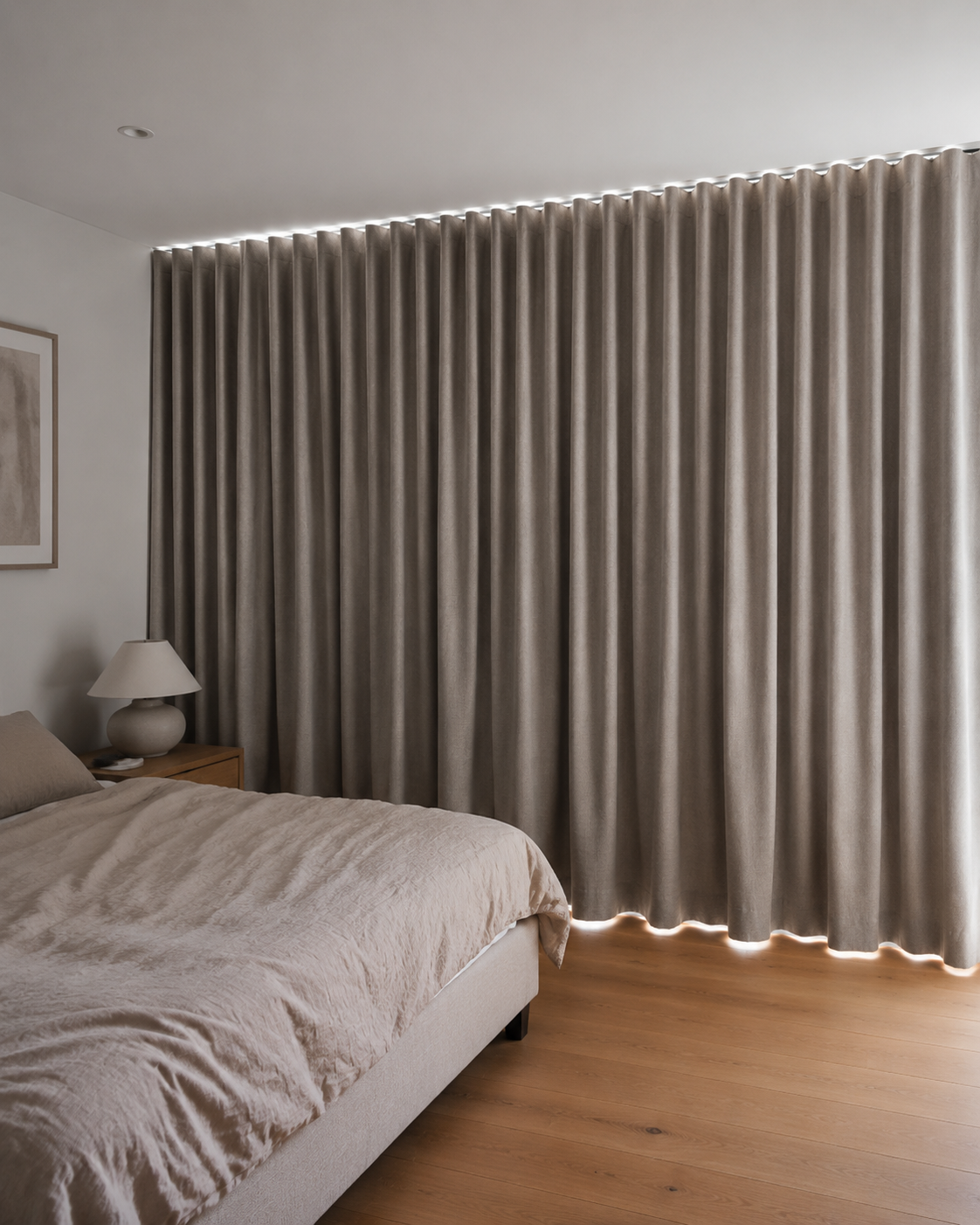 Single ceiling-mounted S-fold blockout curtain closed across a bedroom wall